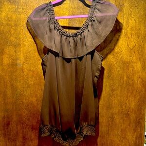 Soft.  Banded waist. Can be worn off shoulder. Rich brown color.